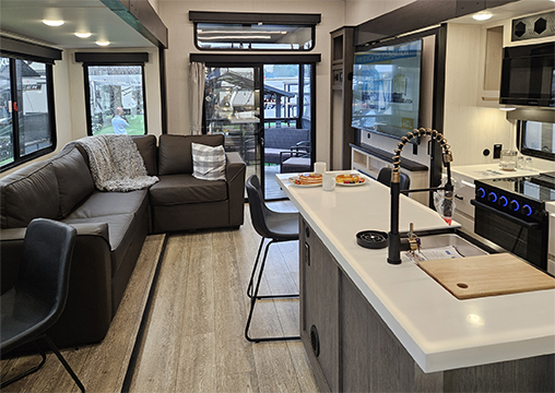 interior layout of arctic wolf 3800deck showing kitchen and entertainment center