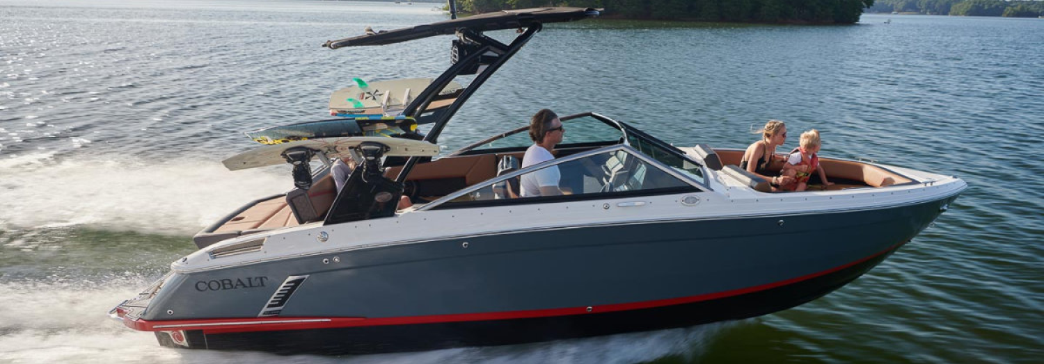 People on a wake boarding boat