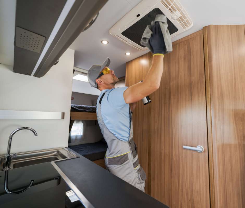 RV technician working on rv